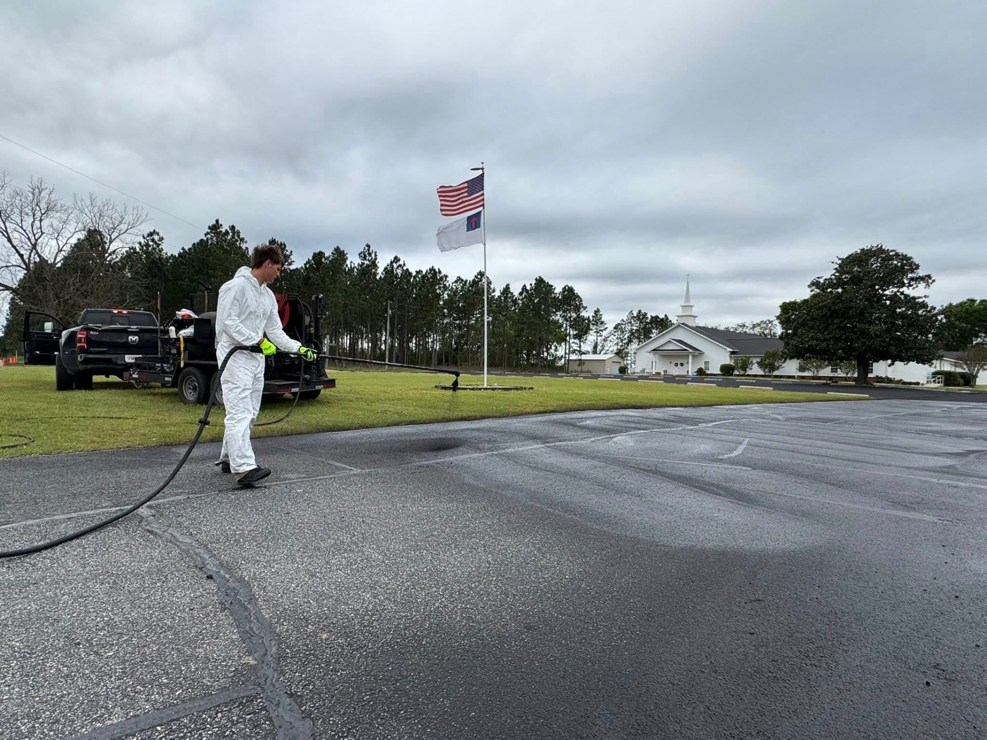 Velvet Coatings applying seal coat at a local church property